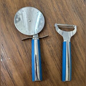 Wolf gang puck kitchen utensils 
Pizza cutter and peeler